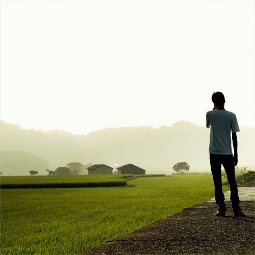 Man standing next to a field by eliot. Ipad wallpaper