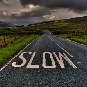fatboyke - slow down sign on the road ipad wallpaper