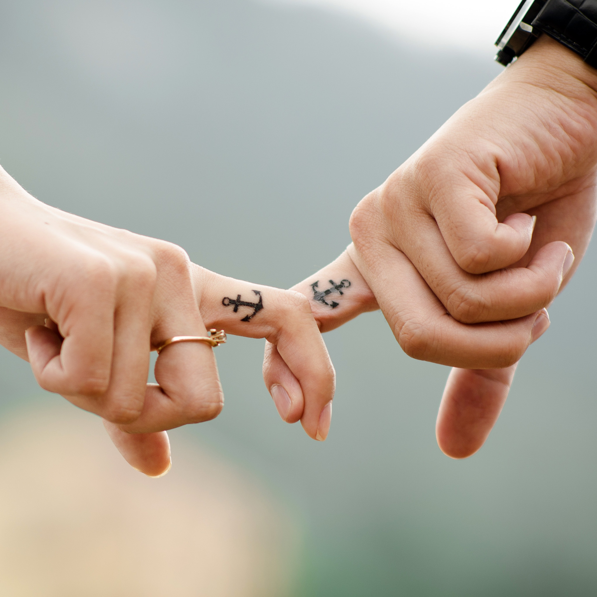 Couple holding fingers iPad Wallpaper